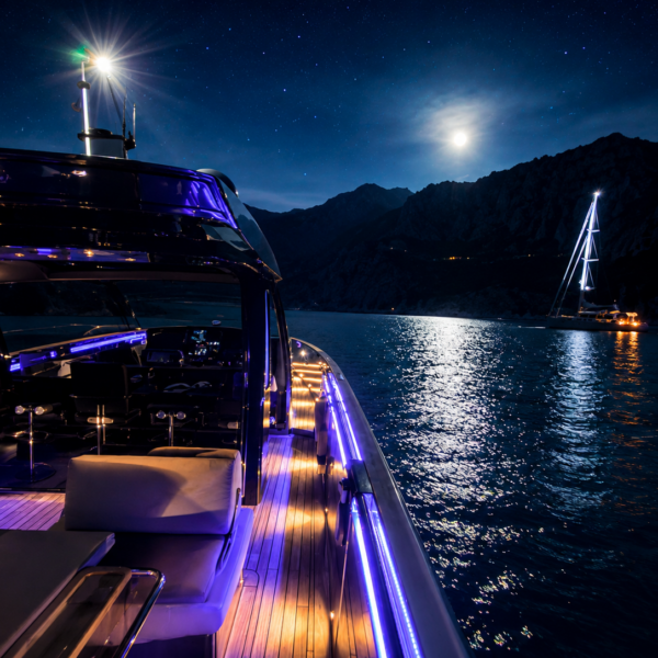 BLACK SHEEP anchored at Cala Tuent after sunset